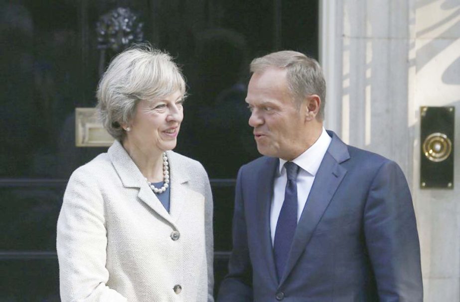 Britain's Prime Minister Theresa May (L) greets European Council President Donald Tusk in Downing Street in London, Britain.