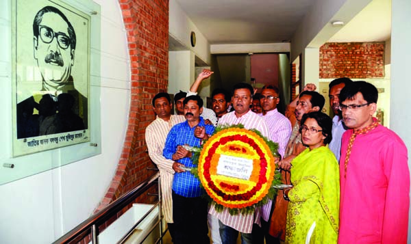 Dhaka Union of Journalists paying tributes to Bangabandhu Sheikh Mujibur Rahman by placing floral wreaths on his portrait at the Jatiya Press Club on Friday marking 98th birthday of Bangabandhu.