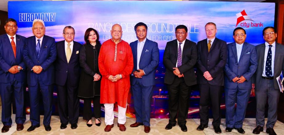 Finance Minister, Abul Maal Abdul Muhith poses with the speakers of a roundtable discussion on "Delivering a vision for growth" organized by City Bank Ltd, in association with Euromoney at a hotel in the city recently. DNCC Mayor Annisul Huq, Chittagong