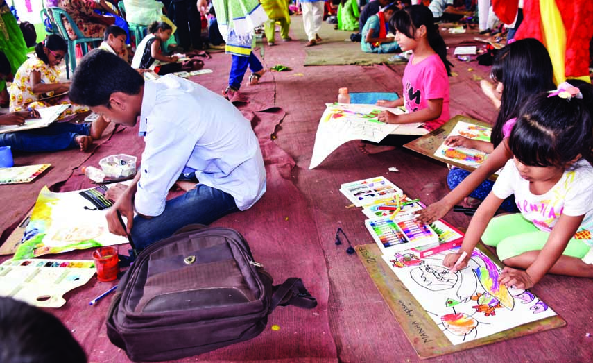 Children engrossed in painting at a drawing competition on 98th birthday of Father of the Nation Bangabandhu Sheikh Mujibur Rahman organised by Bangabandhu Shishu Kishore Mela at 32, Dhanmondi in the city on Saturday.