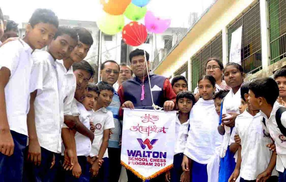 Head of Sports and Welfare Department of Walton Group FM Iqbal Bin Anwar Dawn inaugurating the Walton Talent Hunt School Chess Competition by releasing the balloons as the chief guest at Motijheel Government Primary School premises on Saturday.