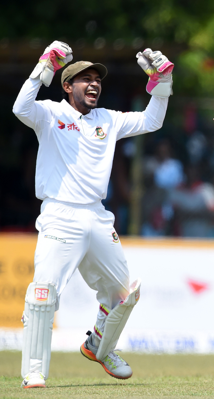 Mushfiqur Rahim rejoices after taking a catch on day four of their second Test cricket match against Sri Lanka in Colombo, Sri Lanka on Saturday .