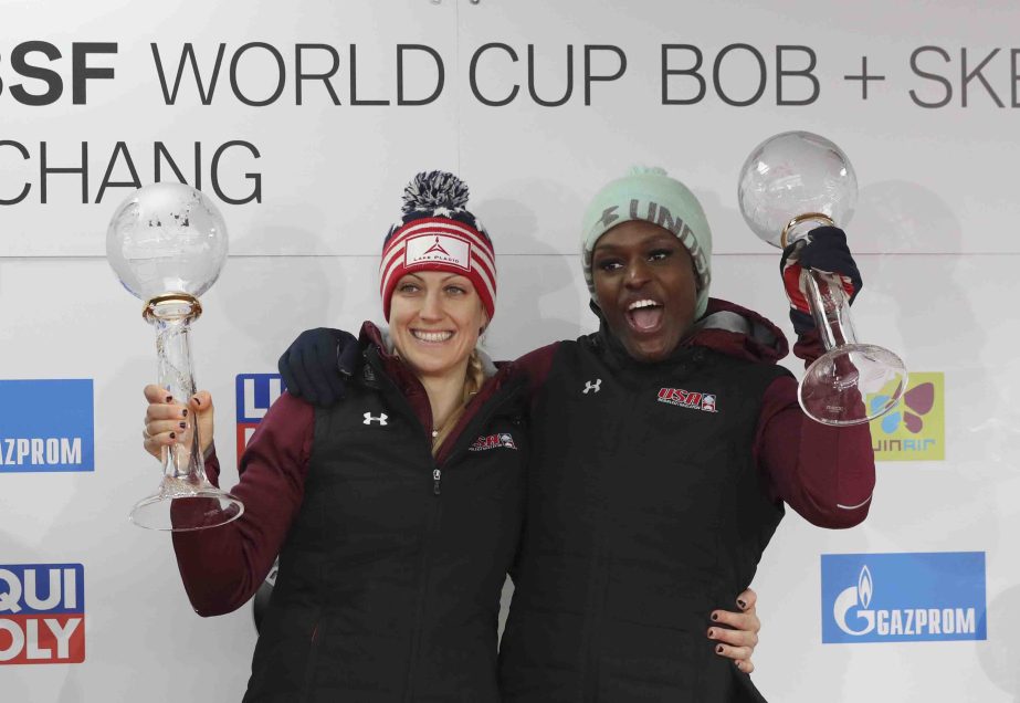 Season winners Jamie Greubel Poser (left) and Aja Evans of the United States celebrate during the ceremony for 20162017 Bobsleigh World Cup season at the Alpensia Sliding Centre in Pyeongchang, South Korea on Saturday.