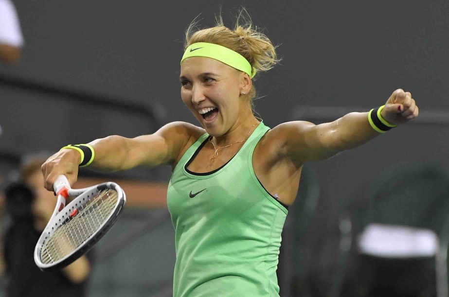 Elena Vesnina of Russia celebrates after winning her match against Kristina Mladenovic of France at the BNP Paribas Open tennis tournament in Indian Wells, Calif. Vesnina won 6-3, 6-4 on Friday.