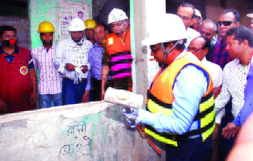 Mayor of Dhaka South City Corporation (DSCC) Mohammad Sayeed Khokon inaugurating the work of demolishing risky buildings at DSCC area on Sunday.