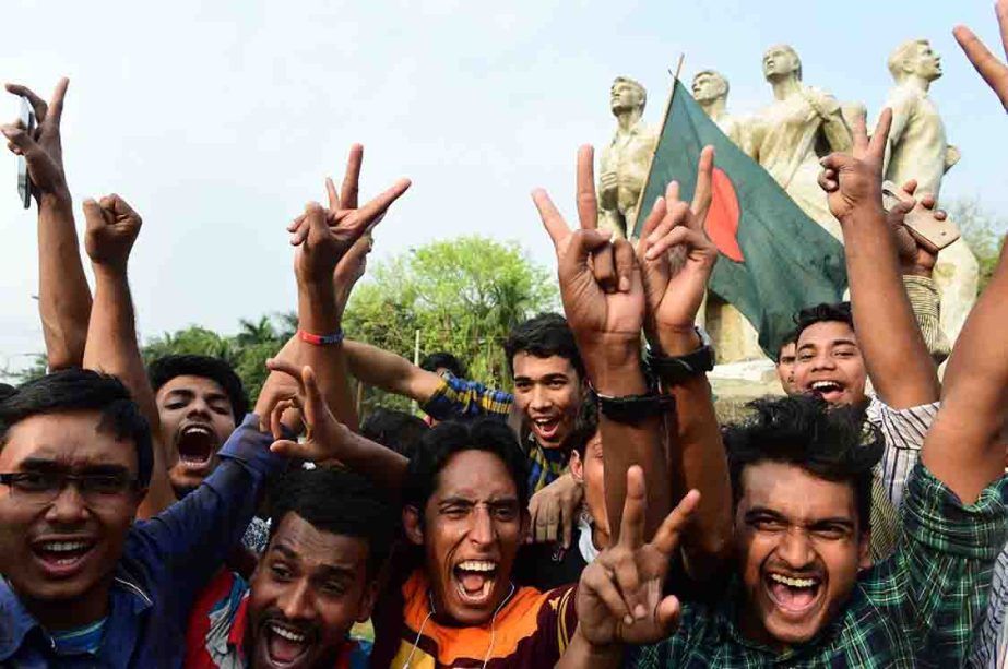 Bangladeshi cricket fans at a university campus in Dhaka celebrate their national team's victory over Sri Lanka on Sunday.Bangladesh pulled off a historic four-wicket win over Sri Lanka in the second Test in Colombo.