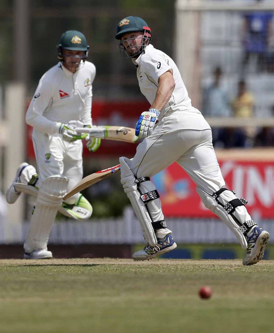 Australia's Shaun Marsh (right) and Peter Handscomb run between the wickets to score runs during the fifth day of their third test cricket match against India in Ranchi, India on Monday.
