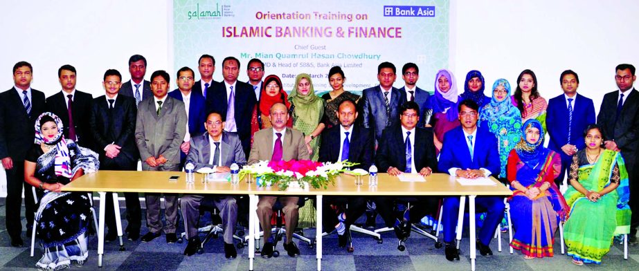 Mian Quamrul Hasan Chowdhury, Deputy Managing of Bank Asia Ltd, poses with the participants of Orientation Program on Islamic Banking and Finance at the bank institute for training & development at Lalmatia in the city on Sunday. AKM Mizanur Rahman, Head