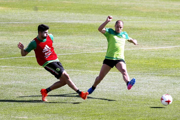 Mexico's Nestor Araujo (left) and Javier Hernandez practice during a training session in Cuernavaca, Mexico on Tuesday. Mexico will face Costa Rica in a 2018 World Cup qualifying soccer match on March 24.