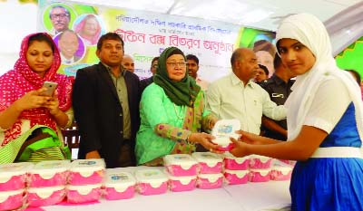 BANCHHARAMPUR (B'baria): Hasu Islam, wife of A B Tajul Islam MP distributing tiffin boxes among the students of South Govt Pry School in Banckharampur Upazila recently.