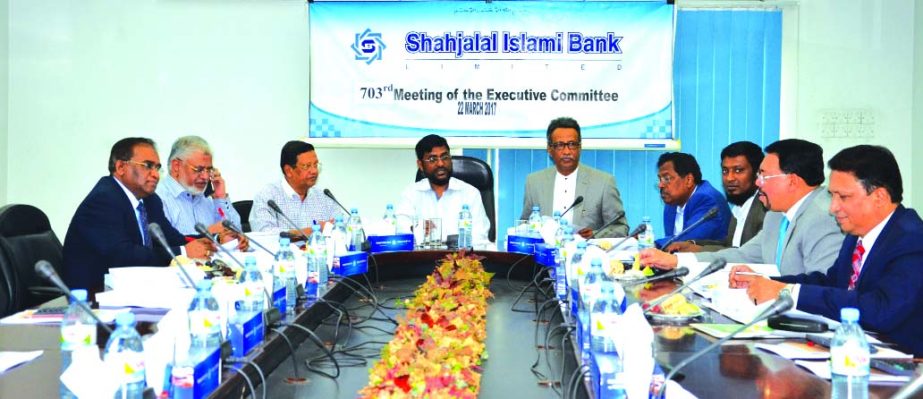 Md Sanaullah Shahid, Chairman of the EC of Shahjalal Islami Bank Limited presiding over its 703rd meeting at the bank's head office in the city recently. Mohiuddin Ahmed, Vice-Chaiman of Board of Directors, Fakir Akhtaruzzaman, Vice-Chaiman of the EC, An