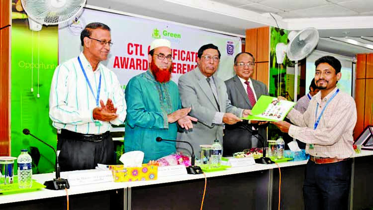 Head of Quality Assurance Unit of University Grants Commission Prof Mesbahuddin Ahmed handing over certificates to a teacher of Green University Bangladesh (GUB) after completion teaching and learning course organised by Green University Center of Excelle