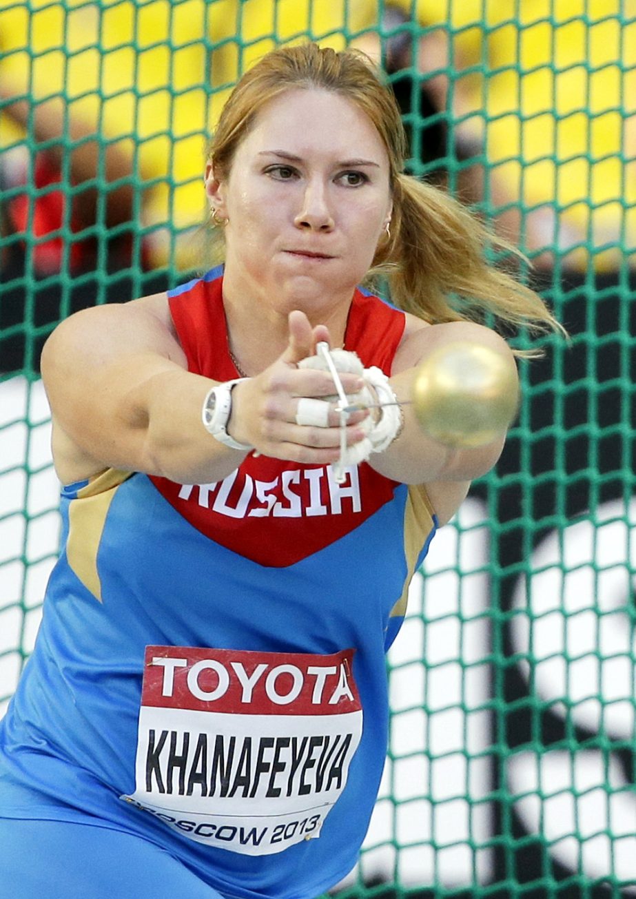 FILE In this Friday, Aug. 16, 2013 file photo Russia's Gulfiya Khanafeyeva competes in the the women's hammer throw final at the World Athletics Championships in the Luzhniki stadium in Moscow, Russia. Russian officials say three of the country's athle