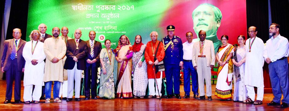 Prime Minister Sheikh Hasina with the recipients of Independence Day Award-2017 at the Osmani Memorial Hall on Thursday.