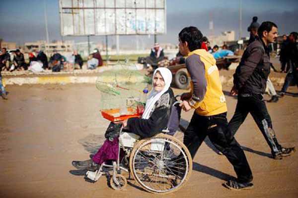 Displaced Iraqis flee their homes as Iraqi forces battle with Islamic State militants in western Mosul, Iraq on Friday.