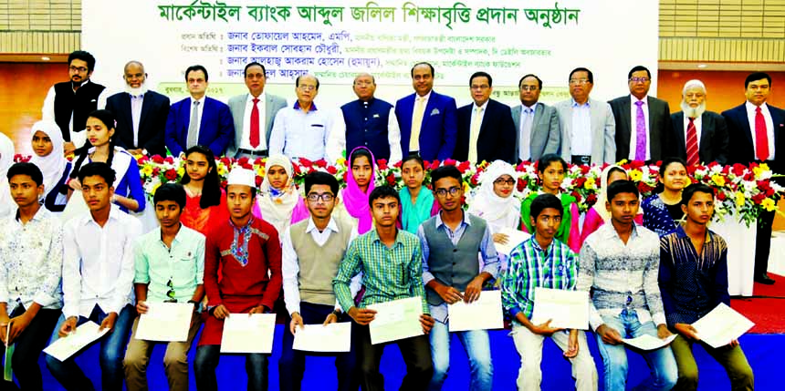 Commerce Minister Tofail Ahmed poses with the partcipants at Mercantile Bank Abdul Jalil Education Scholarship-2015 award giving programme as chief guest at Bangabandhu International Conference Centre in the city on Wednesday. Prime Minister Sheikh Hasi