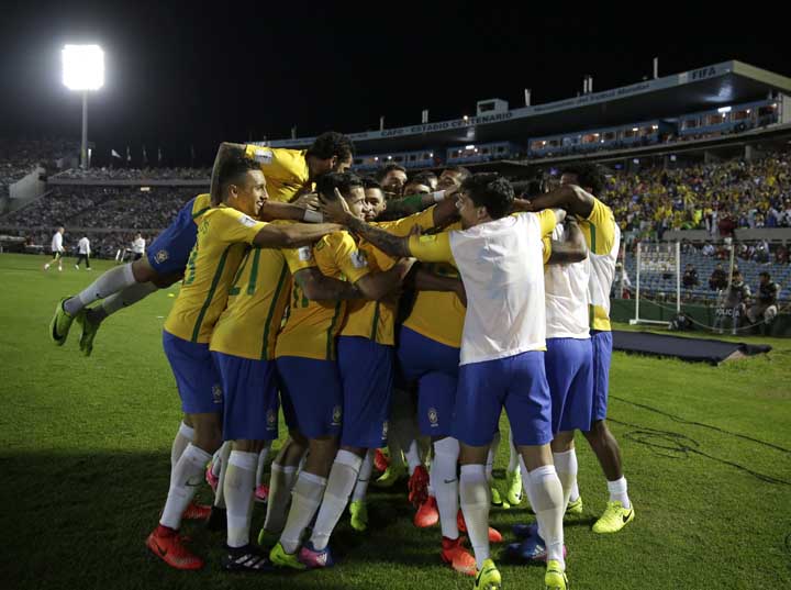 Brazil's players celebrate after teammate Paulinho scored his second goal against Uruguay during a 2018 World Cup qualifying soccer match in Montevideo, Uruguay on Thursday.