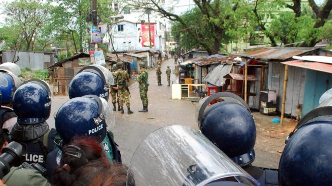 Security forces have been exchanging gunfire with a group of suspected militants holed up in an apartment building in Sylhet