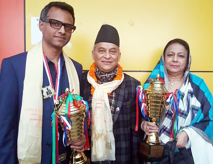GM Mollah Abdullah Al Rakib (left) and WIM Rani Hamid (right), the respective champions of the Asian Zonal 3.2 Chess Open event and Asian Zonal 3.2 Chess Women's qualifying round event with President of Asian Zonal 3.2 Chess Championship Committee Ragesh