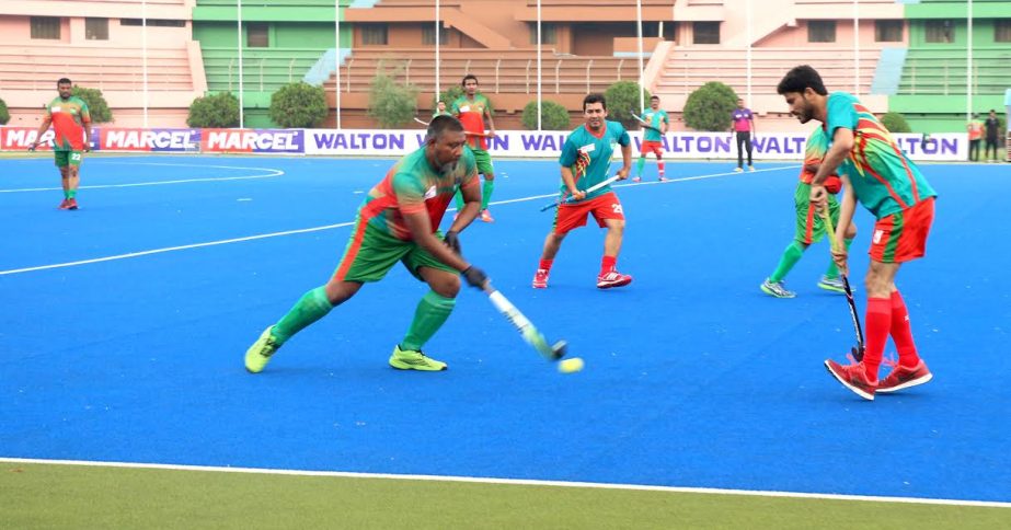 An action from the match of the Independence Day Hockey Competition between Jumman Lusai Hockey XI and Abdul Malek Chunnu XI at the Moulana Bhashani National Hockey Stadium on Tuesday. Jumman Lusai Hockey XI team beat Abdul Malek Chunnu XI team by 4-3 g