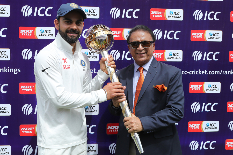 Virat Kohli receives the ICC Test mace from Sunil Gavaskar on the 4th day of 4th Test between India and Australia at Dharamsala on Tuesday.
