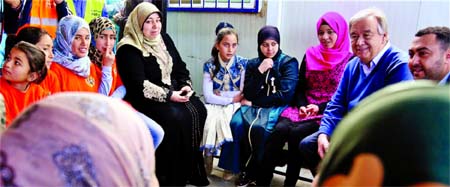 UN Secretary General Antonio Guterres, second left, visits the U.N.-run Zaatari camp for Syrian refugees, in northern Jordan on Tuesday.