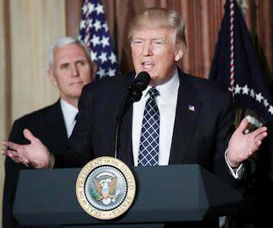 US President Donald Trump speaks prior to signing an executive order on "energy independence," eliminating Obama-era climate change regulations, during an event at the Environmental Protection Agency (EPA) headquarters in Washington on Tuesday.