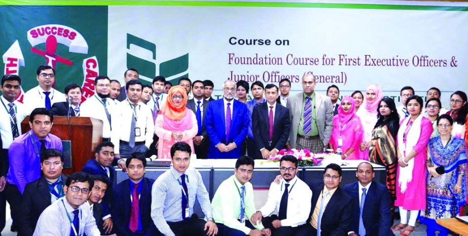Shah Syed Abdul Bari, Deputy Managing Director and Head of Human Resources Division, poses with the participants of "Foundation Course for the First Executive Officers & Junior Officers (General)" (2nd Batch) of National Bank Limited at itsTraining Inst