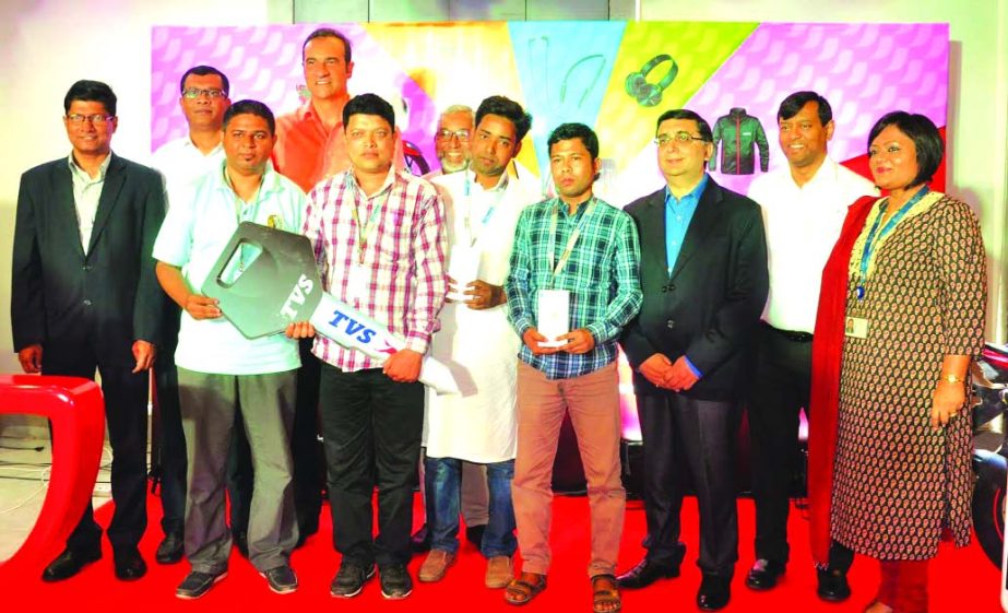 StÃ©phane NordÃ©, Managing Director of NestlÃ© Bangladesh Ltd, handing over Mega Prize, TVS Apache RTR 150 Motorcycle to Kazi Ahmad Sayeeduzzaman of Dhanmondi, at a ceremony at its head office on Tuesday.