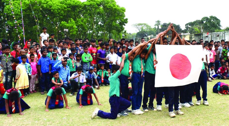 MITHAPUKUR (Rangpur): Students of Mithapukur Ararsha Shishu Niketon displaying at the Independence Day parade on Sunday.