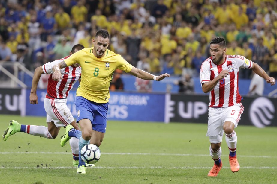 Paraguay's Bruno Valdez, right, challenges for the ball Brazil's Neymar during their 2018 World Cup qualifying soccer match at the Arena Corinthians Stadium in Sao Paulo, Brazil on Tuesday.