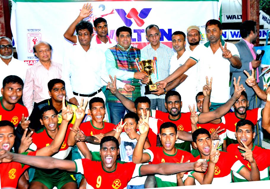 Bangladesh Army, the champions of the Walton Independence Day Volleyball Competition with the guests and officials of Bangladesh Volleyball Federation pose for a photo session at Dhaka Volleyball Stadium on Wednesday.
