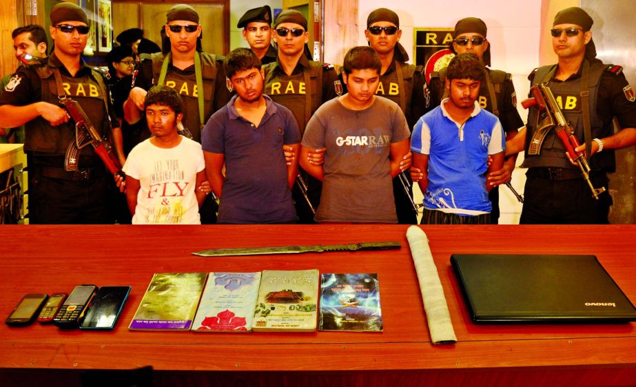 Four alleged teenage members of Neo-JMB of 'Sarwar-Tamim Group' were arrested by RAB-10 team in Dohar upazila' with some jehadi books, lethal weapons and a laptop. This photo was taken from RAB Media Centre in city on Wednesday.