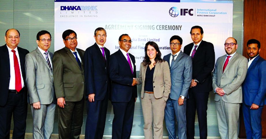 Syed Mahbubur Rahman, Managing Director of Dhaka Bank Limited and Ariane Di Iorio, Regional Industry Manager (South Asia) of International Finance Corporation (IFC) shaking hand after signed $55m Facilities Agreements at the banks Corporate Office in the
