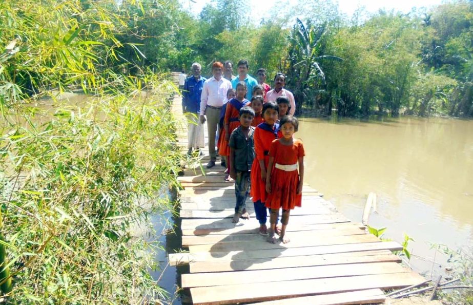 An iron bridge is needed immediately over Himchhori Canal in Ukhiya Upazila as people of the Upazila are using the risky bamboo bridge . This picture was taken on Friday.