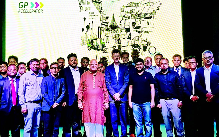 Finance Minister Abul Maal Abdul Muhith, poses with the Grammen Phone official at the inaugural ceremony of GPAccelerator at its head office recently.