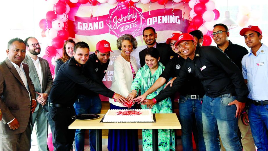 US Ambassador to Bangladesh Marcia Stephen Bloom Bernicat inaugurating a America-based burger chain 'Johnny Rockets' outlet at Uttara in the city on Saturday. Fred Joosten, Chief Operating Officer of Johnny Rockets Bangladesh and Executives of the franc