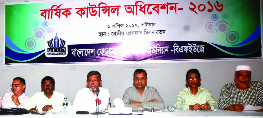 Journalist Shawkat Mahmud speaking at a discussion on annual council session-2016 of a faction of BFUJ at the Jatiya Press Club on Saturday.