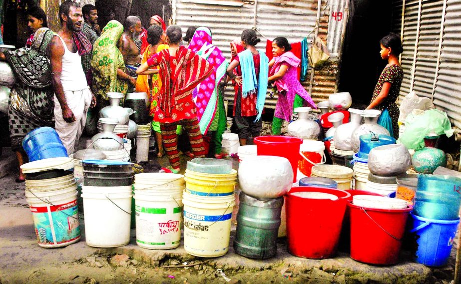 Rush in front of water pump house with pitchers as drinking water crisis deepen on Saturday in different parts of the city due to disruption of supply by WASA following road-digging work.
