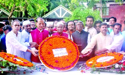 TUNGIPARA (Gopalganj): Newly-elected leaders of Bangabandhu Foundation led by its President Adv Daudur Rahman Mina and General Secretary Zakir Hossain Badal placing wreaths at the Mausoleum of Bangabandhu Sheikh Mujibur Rahman at Tungipara recently.