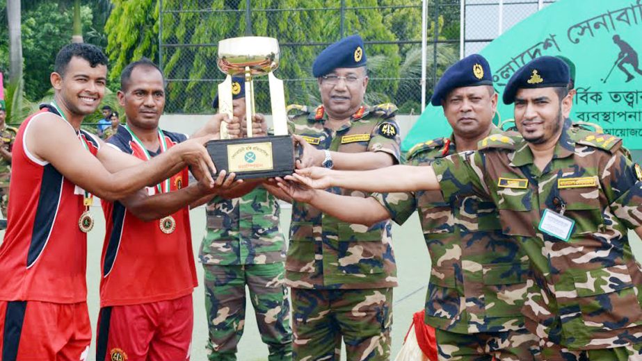 GOC of 9 Infantry Division and Commander of Savar Area Major General Mohammad Akbar Hossain handing over the champions trophy to 9 Infantry Division Hockey team, which emerged as the champions of Bangladesh Army Hockey Competition at Savar Cantonment in S