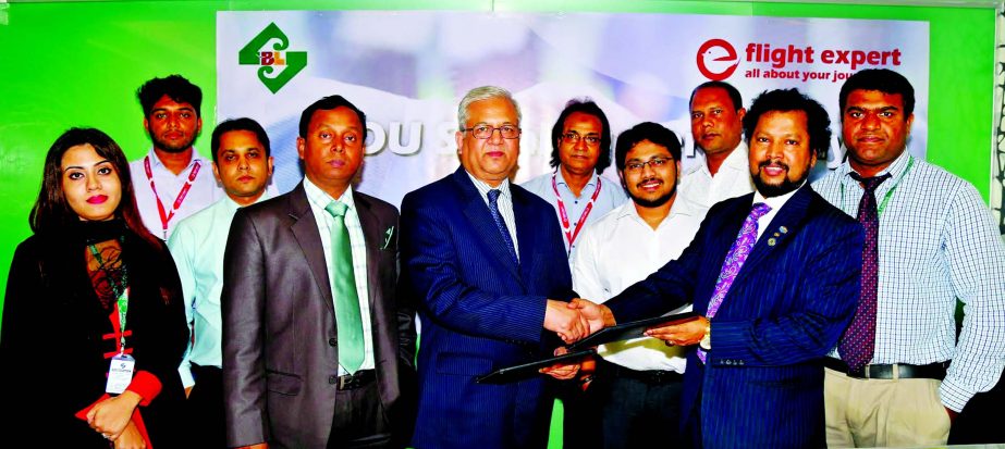 Sharif Zahirul Islam, Head of Cards of Standard Bank Limited and Lion MA Rashid Shah Samrat, Chairman, Makkah Group of Companies, exchanging documents after signing an agreement in the city recently. Under the deal, Standard Bank Cardholders and employees