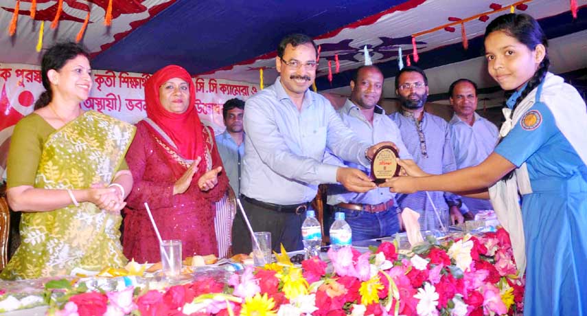 CCC Mayor A J M Nasir Uddin distributing prizes among the winners of annual sports and cultural competition of Jamal Khan Kusum Kuhmari City Corporation Girls' High School as Chief Guest on Sunday.