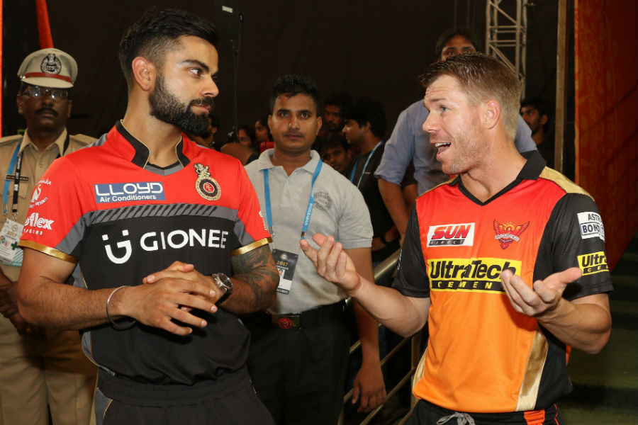 Virat Kohli and David Warner chat during the IPL opening ceremony at Hyderabad on Wednesday.