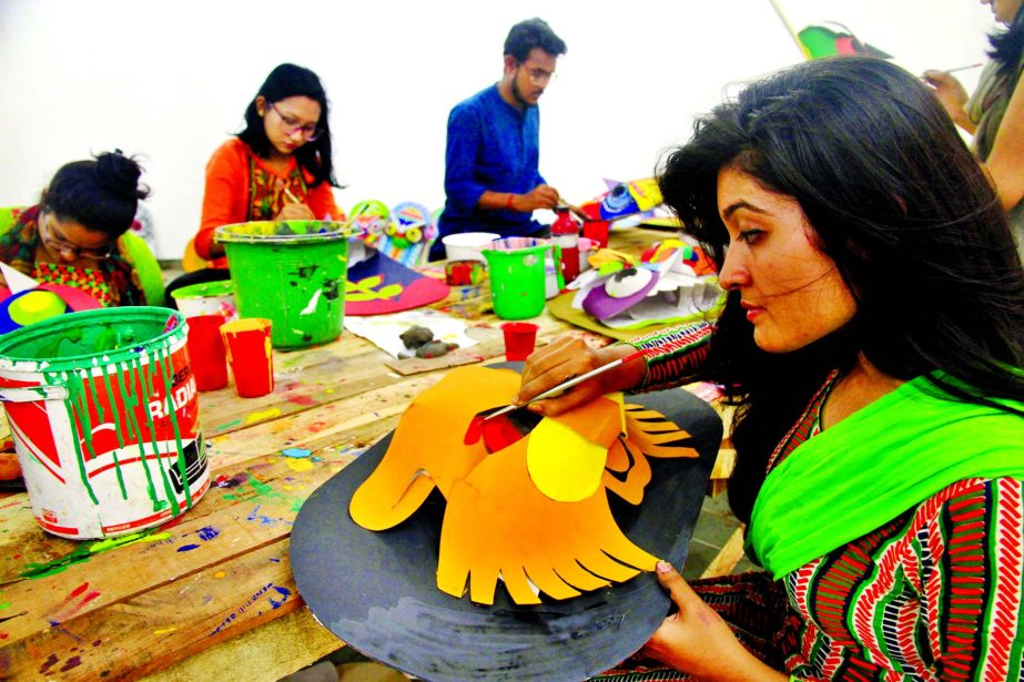 Students of the Faculty of Fine Arts of Dhaka University now spend busy time in making different colourful festoons, including masks, to celebrate the Pahela Boishakh, the first day of the Bengali New Year, which is just a week away. This photo was taken