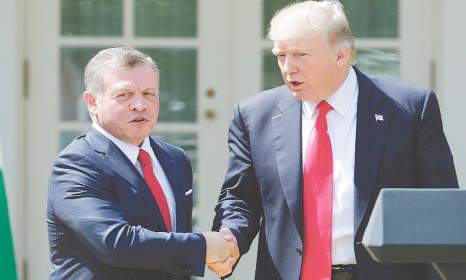US President Donald Trump shaking hands with Jordan's King Abdullah at the conclusion of their joint news conference at White House on Wednesday.