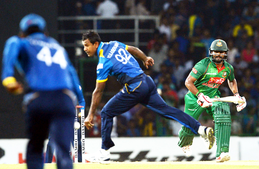 Imrul Kayes takes off for a run after pushing it past Nuwan Kulasekara during the 2nd T20I between Sri Lanka and Bangladesh at Colombo on Thursday.