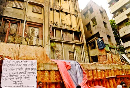 A multi-storey building tilted at Elephant Road in the city on Thursday as construction work of another building is going there. Employees of two banks, RMG factory workers and staffs of other offices have been evacuated yesterday following the incident.