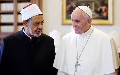 Pope Francis chats with Sheik Ahmed el-Tayyib, the grand imam of the Sunni Muslim center of learning, during the pair's historic meeting at the Vatican.