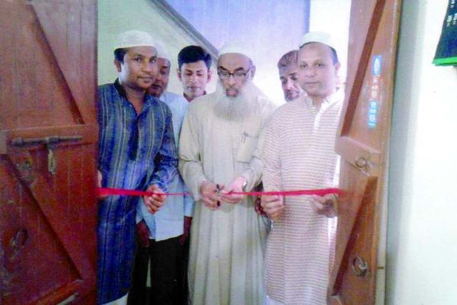 Principal Dr. Abdul Karim inaugurating Homeo Care at Lalchand Road, Chowkbazar in the city recently.